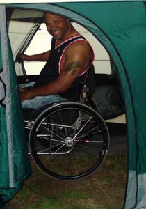 Camper enjoing a Wheelchair Accessible Tent