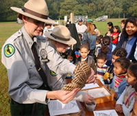 Image of a Urban Park Ranger with a child