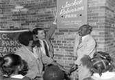 1978 groundbreaking ceremony for the rehabilitation and renaming of Colonial Park Recreation Center (now Jackie Robinson Recreation Center) in Manhattan. From left to right: David Robinson (son of Jackie Robinson), Commissioner Gordon J. Davis, and Councilman Fred Samuel.