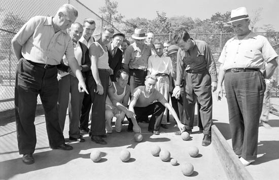 Men gather on the Crotona Park bocce courts, September 18, 1941. Courtesy of Parks Photo Archive, Neg. 20735.