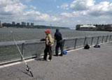 People fishing at West Harlem Piers