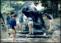 Photo of conservators working on restoring a monument