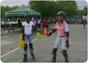 Two girls rollerblading