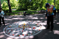 A visitor inspects the monument and contemplates its meaning