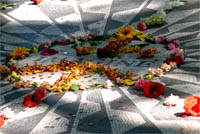 Visitors frequently drape the Imagine monument in flowers as a tribute to John Lennon
