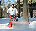 Work at Parks Maintenance and Operations - Parks maintenance worker clearing up snow in th parks for public safety